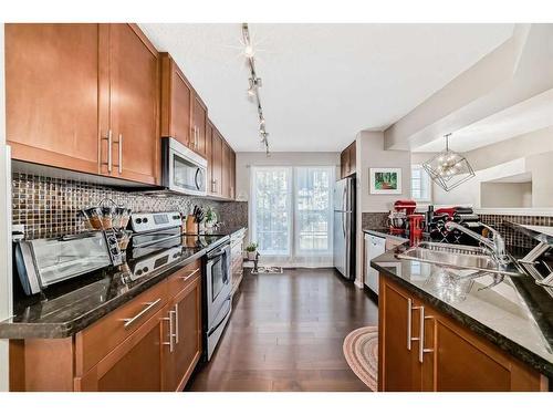 103 Auburn Bay Common Se, Calgary, AB - Indoor Photo Showing Kitchen With Stainless Steel Kitchen With Double Sink