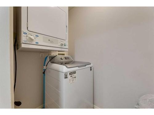 2405-505 Railway Street West, Cochrane, AB - Indoor Photo Showing Laundry Room