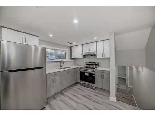 68 Pensville Road Se, Calgary, AB - Indoor Photo Showing Kitchen With Double Sink