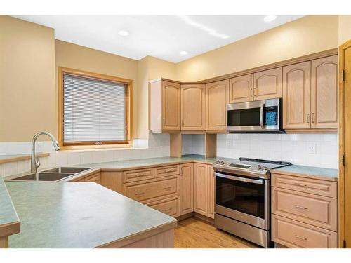 139 Arbour Wood Close Nw, Calgary, AB - Indoor Photo Showing Kitchen With Double Sink