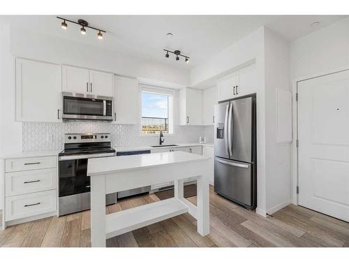 3104-3727 Sage Hill Drive Nw, Calgary, AB - Indoor Photo Showing Kitchen With Stainless Steel Kitchen With Upgraded Kitchen