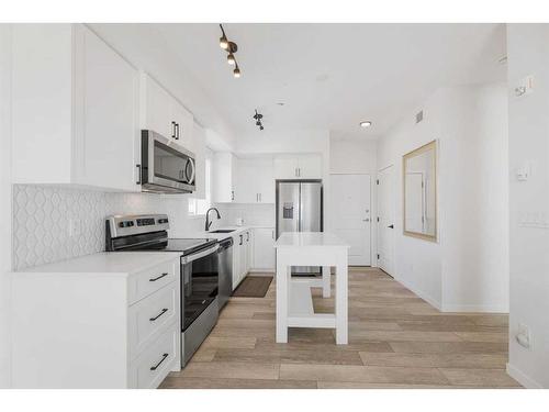 3104-3727 Sage Hill Drive Nw, Calgary, AB - Indoor Photo Showing Kitchen With Stainless Steel Kitchen With Upgraded Kitchen