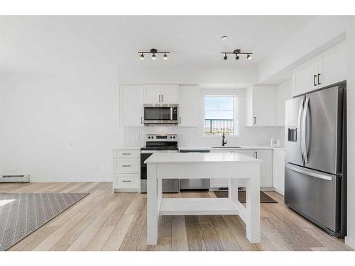 3104-3727 Sage Hill Drive Nw, Calgary, AB - Indoor Photo Showing Kitchen With Stainless Steel Kitchen With Upgraded Kitchen