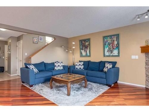 1152 Harvest Hills Drive Ne, Calgary, AB - Indoor Photo Showing Living Room With Fireplace