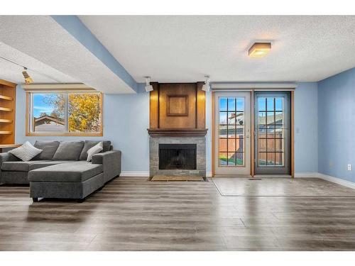 220 Templewood Road Ne, Calgary, AB - Indoor Photo Showing Living Room With Fireplace