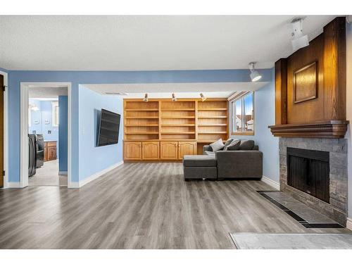 220 Templewood Road Ne, Calgary, AB - Indoor Photo Showing Living Room With Fireplace