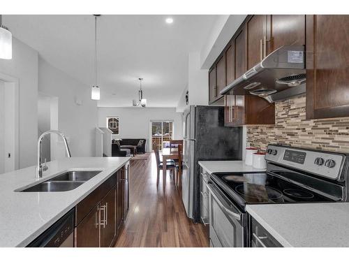 11 Redstone Circle Ne, Calgary, AB - Indoor Photo Showing Kitchen With Stainless Steel Kitchen With Double Sink With Upgraded Kitchen