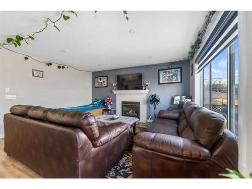 183 Saddleback Road, Calgary, AB - Indoor Photo Showing Living Room With Fireplace