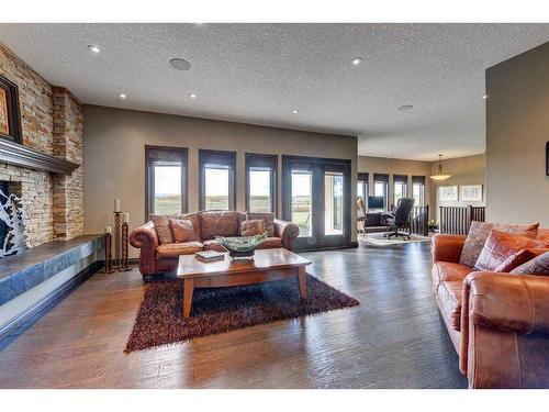 15 Vantage Ridge Estates, Rural Rocky View County, AB - Indoor Photo Showing Living Room With Fireplace