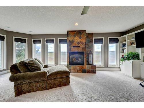 15 Vantage Ridge Estates, Rural Rocky View County, AB - Indoor Photo Showing Living Room With Fireplace