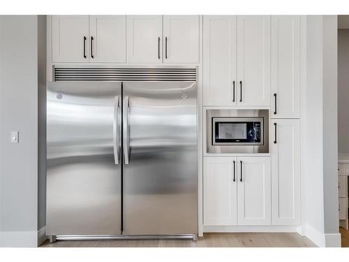 1209 Coopers Drive Sw, Airdrie, AB - Indoor Photo Showing Kitchen