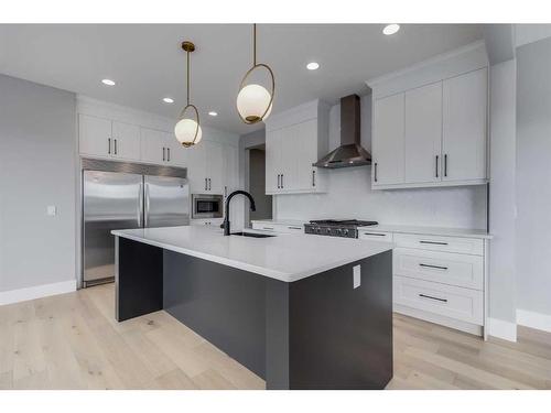 1209 Coopers Drive Sw, Airdrie, AB - Indoor Photo Showing Kitchen With Upgraded Kitchen