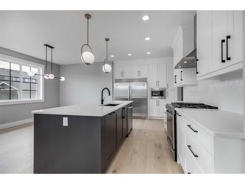 1209 Coopers Drive Sw, Airdrie, AB - Indoor Photo Showing Kitchen With Upgraded Kitchen