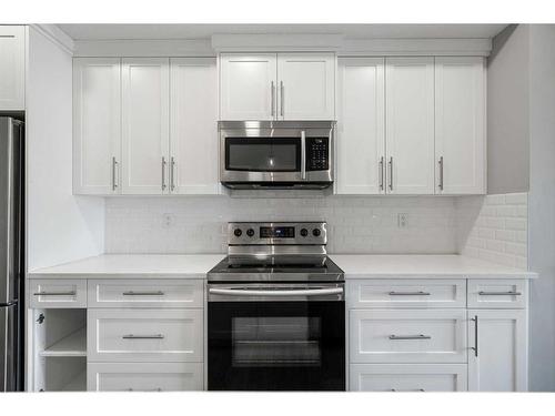 204-360 Harvest Hills Common Ne, Calgary, AB - Indoor Photo Showing Kitchen