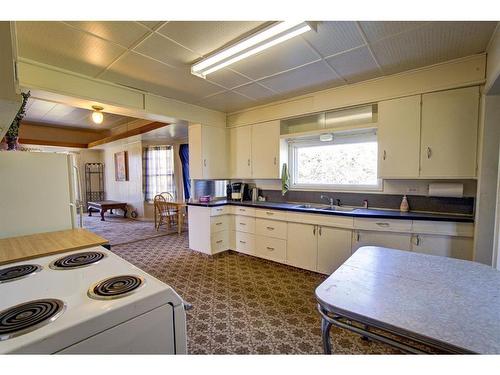 4530 2 Street East, Claresholm, AB - Indoor Photo Showing Kitchen With Double Sink