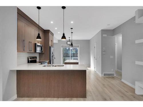 529-72 Cornerstone Manor Ne, Calgary, AB - Indoor Photo Showing Kitchen With Double Sink