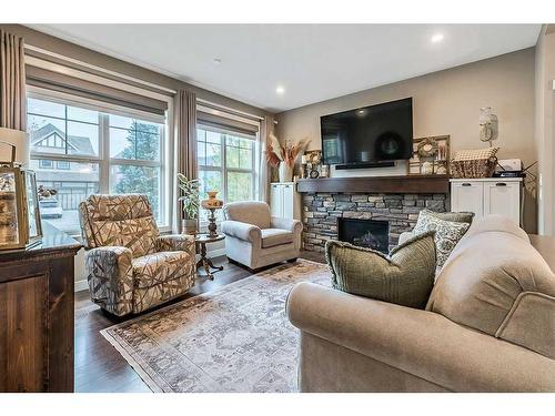 83 Masters Avenue Se, Calgary, AB - Indoor Photo Showing Living Room With Fireplace