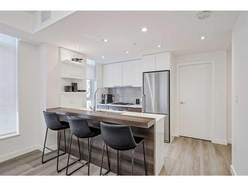 410-138 Waterfront Court Sw, Calgary, AB - Indoor Photo Showing Kitchen With Stainless Steel Kitchen