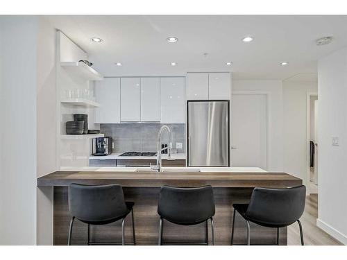 410-138 Waterfront Court Sw, Calgary, AB - Indoor Photo Showing Kitchen With Stainless Steel Kitchen With Upgraded Kitchen