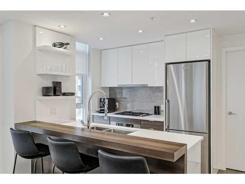 410-138 Waterfront Court Sw, Calgary, AB - Indoor Photo Showing Kitchen With Stainless Steel Kitchen With Upgraded Kitchen