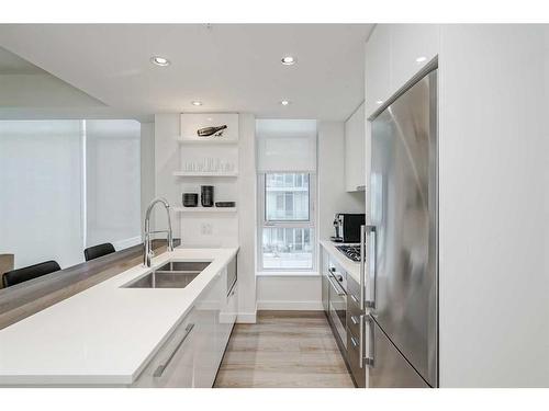 410-138 Waterfront Court Sw, Calgary, AB - Indoor Photo Showing Kitchen With Double Sink With Upgraded Kitchen