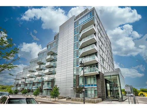 410-138 Waterfront Court Sw, Calgary, AB - Outdoor With Balcony With Facade