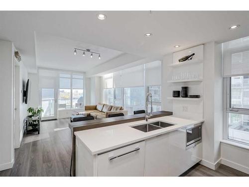 410-138 Waterfront Court Sw, Calgary, AB - Indoor Photo Showing Kitchen With Double Sink