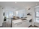 410-138 Waterfront Court Sw, Calgary, AB  - Indoor Photo Showing Kitchen With Double Sink 