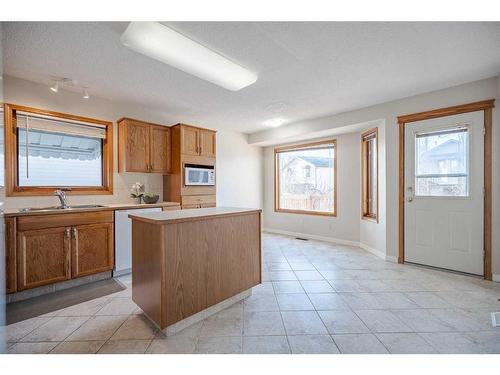 106 Harvest Wood Way Ne, Calgary, AB - Indoor Photo Showing Kitchen With Double Sink