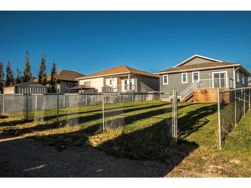 2018 31 Avenue, Nanton, AB - Outdoor With Deck Patio Veranda