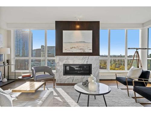 2421-222 Riverfront Avenue Sw, Calgary, AB - Indoor Photo Showing Living Room With Fireplace