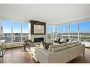 2421-222 Riverfront Avenue Sw, Calgary, AB  - Indoor Photo Showing Living Room With Fireplace 