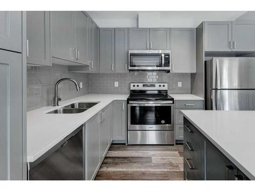 47 Sage Bluff Circle Nw, Calgary, AB - Indoor Photo Showing Kitchen With Stainless Steel Kitchen With Double Sink With Upgraded Kitchen