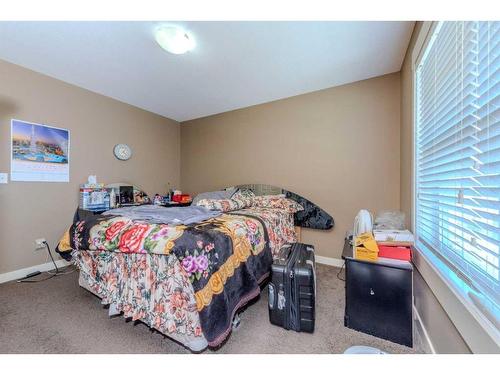 117 Rainbow Falls Manor, Chestermere, AB - Indoor Photo Showing Bedroom