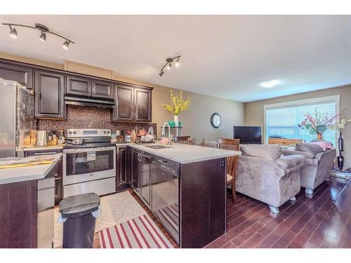 117 Rainbow Falls Manor, Chestermere, AB - Indoor Photo Showing Kitchen With Double Sink