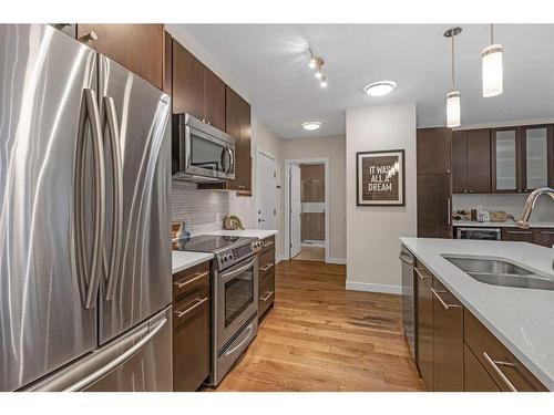 202-836 Royal Avenue Sw, Calgary, AB - Indoor Photo Showing Kitchen With Stainless Steel Kitchen With Double Sink With Upgraded Kitchen