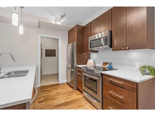 202-836 Royal Avenue Sw, Calgary, AB - Indoor Photo Showing Kitchen With Stainless Steel Kitchen With Double Sink