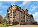 312-30 Mahogany Mews Se, Calgary, AB  - Outdoor With Balcony With Facade 