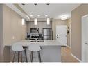 312-30 Mahogany Mews Se, Calgary, AB  - Indoor Photo Showing Kitchen With Stainless Steel Kitchen With Double Sink With Upgraded Kitchen 