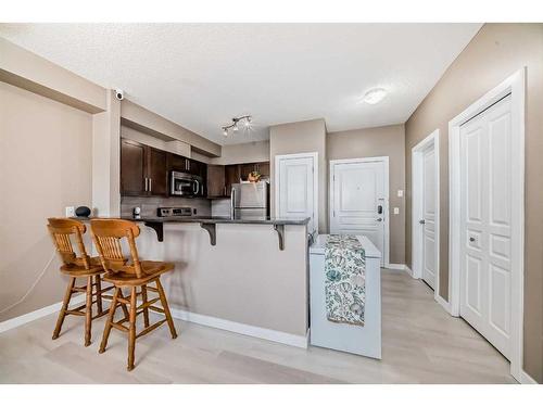 104-22 Panatella Road Nw, Calgary, AB - Indoor Photo Showing Kitchen