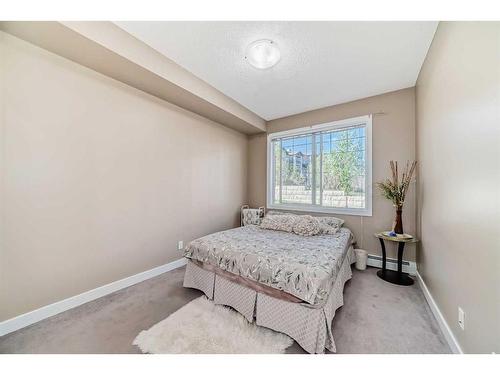 104-22 Panatella Road Nw, Calgary, AB - Indoor Photo Showing Bedroom