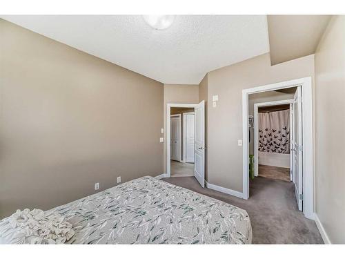 104-22 Panatella Road Nw, Calgary, AB - Indoor Photo Showing Bedroom