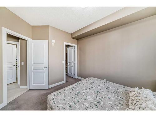 104-22 Panatella Road Nw, Calgary, AB - Indoor Photo Showing Bedroom