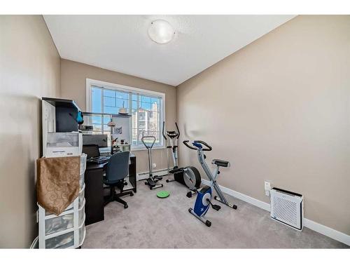 104-22 Panatella Road Nw, Calgary, AB - Indoor Photo Showing Gym Room