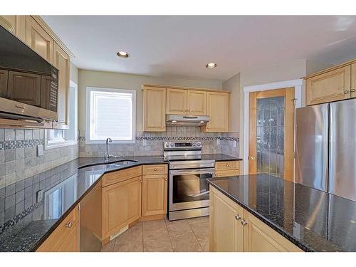 86 Arbour Stone Crescent Nw, Calgary, AB - Indoor Photo Showing Kitchen With Stainless Steel Kitchen With Double Sink