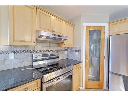 86 Arbour Stone Crescent Nw, Calgary, AB - Indoor Photo Showing Kitchen With Stainless Steel Kitchen With Upgraded Kitchen