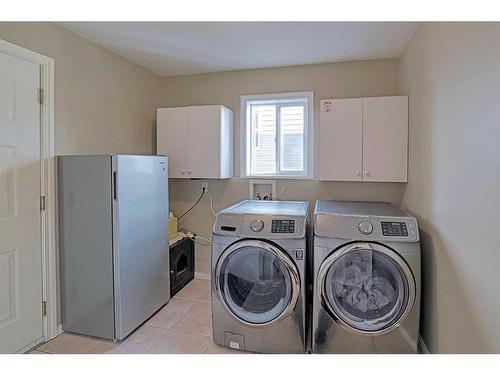 86 Arbour Stone Crescent Nw, Calgary, AB - Indoor Photo Showing Laundry Room