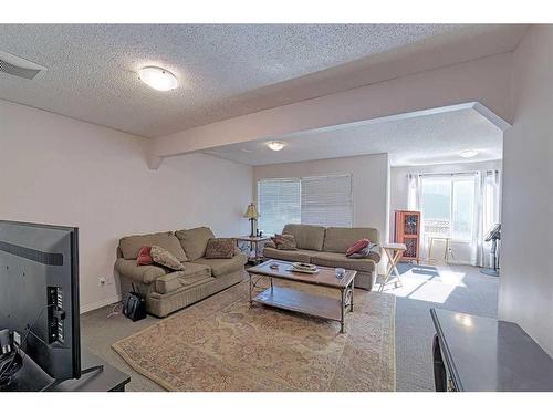 86 Arbour Stone Crescent Nw, Calgary, AB - Indoor Photo Showing Living Room