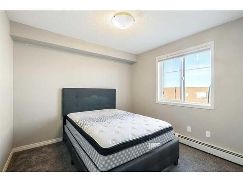 304-102 Cranberry Park Se, Calgary, AB - Indoor Photo Showing Bedroom