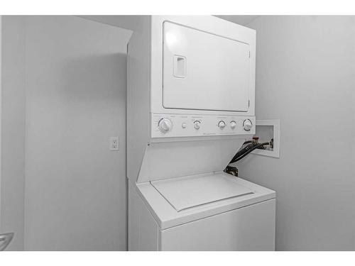 104-716 3 Avenue Nw, Calgary, AB - Indoor Photo Showing Laundry Room